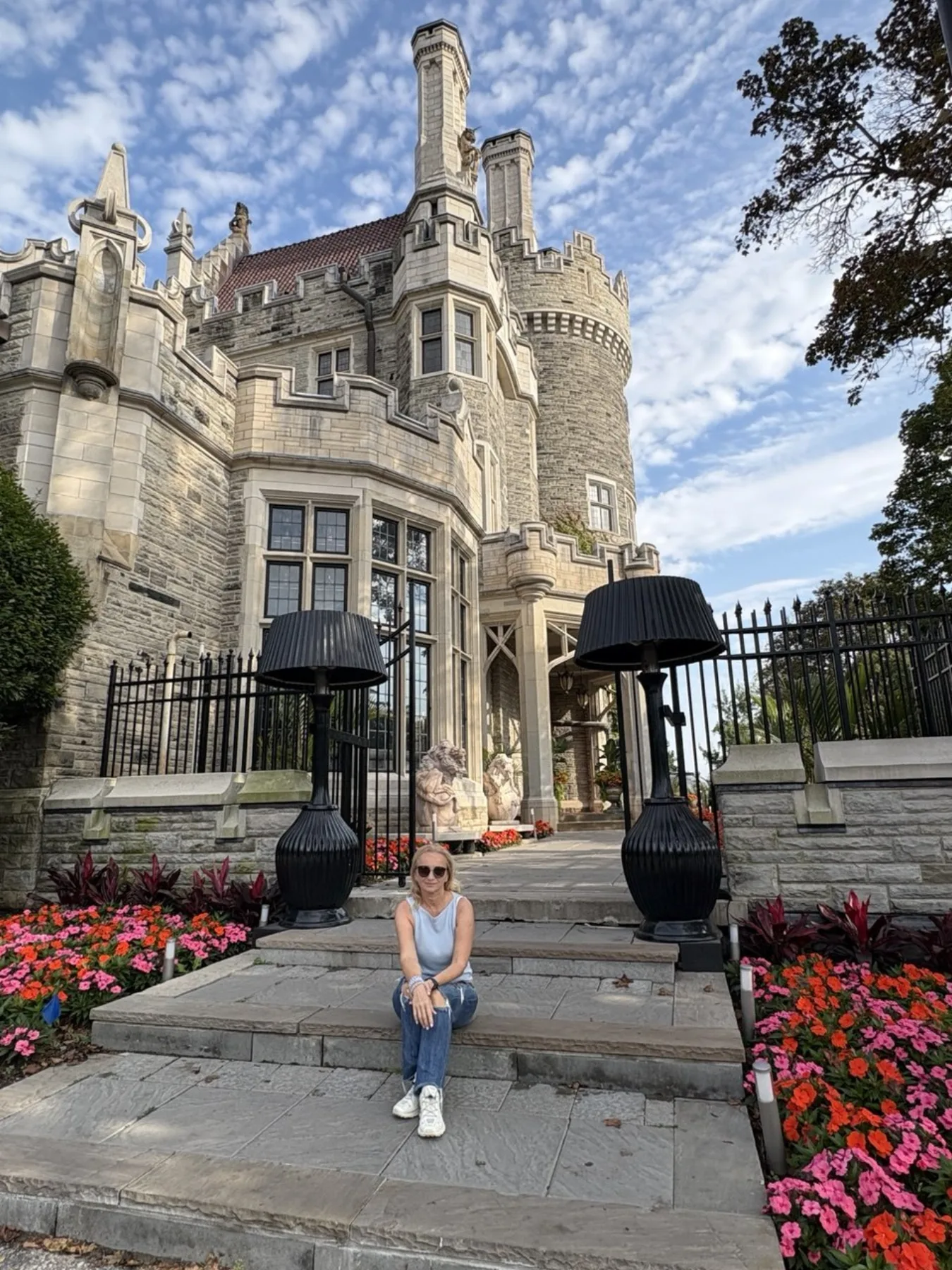 Tatiana outside a historic property and garden